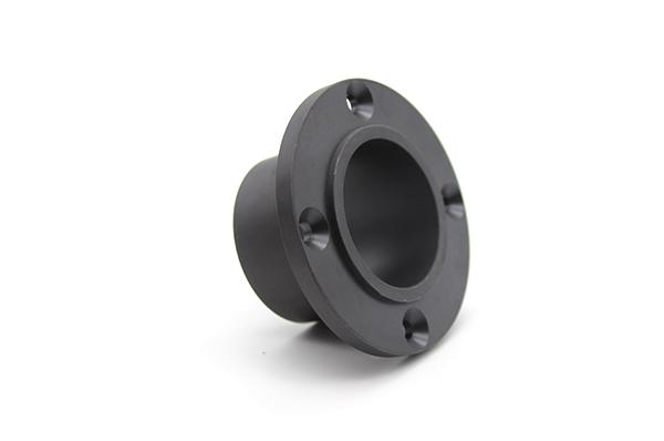 Manguito negro de PEEK (con brida)